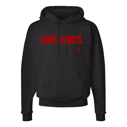 Black hoodie with the text 'LOVE HURTS' printed in red on the front.